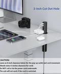 No Sweat Install 2 Inch Pop Up Receptacle For Countertops And Desks, shown in a desk with 2-inch cutout, charging devices with USB and AC ports.