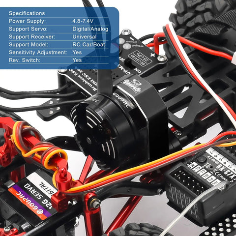 Close-up of SCX24 RC car showing Upgrade 30A Brushless ESC And 2204 2400KV Brushless Outrunner Motor with accessories.