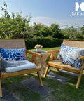 Set Of 2 Waterproof Outdoor Throw Pillows With Inserts, 18x18 Inch Square Cushions on patio chairs in garden setting