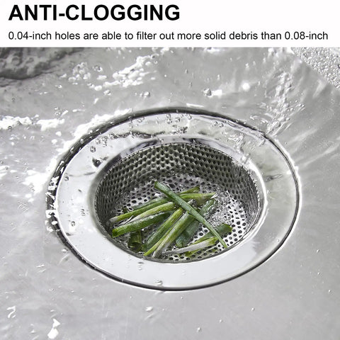 Premium Two Pack Stainless Steel Kitchen Sink Strainers With Wide Four Point Five Inch Rim filtering green debris in sink.