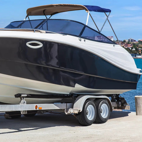 Boat on trailer with 2 Pack 4.80-8 Trailer Tires With 8 Inch Rims 4 Lug On 4 Inch Bolt Pattern Center Bore 2.85 Inch