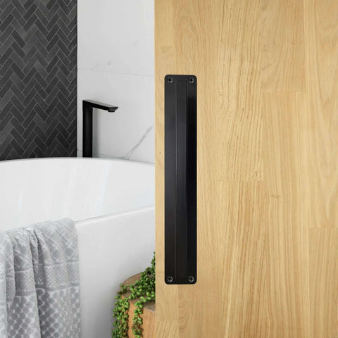 10 Inch Sliding Door Handle Black Beefy Workhorse Barn Door Pull on wood door, bathroom background, rust resistant finish.
