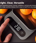 Person using Beast Mode Kitchen Scale for Bulk Cooking 22 Pound Digital Food Scale with 1 Gram Precision and LCD