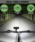 Beefy 1200 Lumen USB C Rechargeable Bike Light for night riding, showing 3 LEDs beam, 180° rotatable head, illuminating dark forest path.