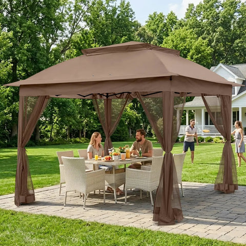 11x11 Pop Up Gazebo With Mesh Netting And UPF 50 Plus UV Protection, No Tool Setup Easy Up Outdoor Canopy Tent, Water Resistant Shelter Providing 121 Sq Ft Of Coverage, Portable Brown shown assembled in a garden setting with furniture underneath.