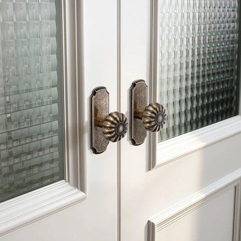 Vintage Antique Brass Cabinet Knobs With Backplates 8 Pack Drawer Pulls installed on glass-paneled cabinet doors