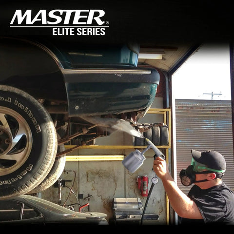 Street Ready Heavy Duty Pneumatic Undercoating Spray Gun With Adjustable Regulator And Beefy 25 Oz Suction Cup For Rust Proofing Truck Bed Liners Plus Slick Auto Finishes in use under a vehicle.