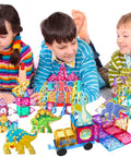 Children playing with Magnetic Tiles Building Blocks Set for Kids 110 Pieces STEM Construction Toy with Dinosaur Figures.
