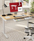 Electric Height Adjustable Standing Desk With Built In Drawer Smooth Motor Lift And Generous Workstation Surface For Home Office Ergonomic Sit Stand Table To Kick Up Your Remote Hustle with maple top and modern chair.