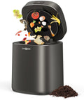 Gray electric kitchen compost bin for indoor countertop with 3 modes, showing food scraps converting to compost.