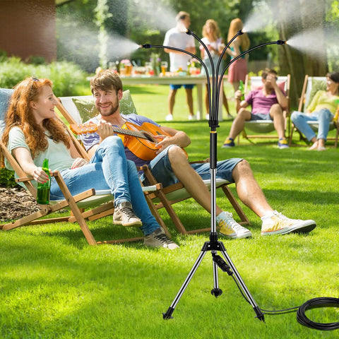 Adjustable Standing Misting System For Outdoor Patio, 4.1 Ft Height With Tripod Stand, cooling lawn with people relaxing.