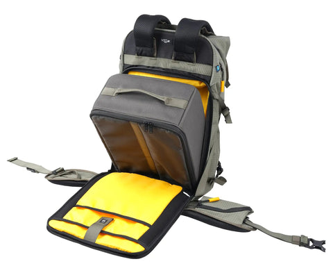 Active 53 Camera Backpack With Front Rear And Top Access For Gear Built In USB Charger Port For Power Bank Removable Camera Box Insert Versatile For Photo Video Gear And Outdoor Travel In Khaki Green showing open front compartment and yellow interior.