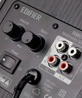 Back panel of 4 Inch Active Bookshelf Speakers With 24W RMS Front Ported Desktop Studio Monitor, showing RCA and AUX inputs.