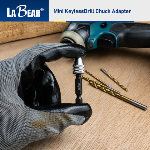 Keyless Mini Drill Chuck Adapter With One Quarter Inch Hex Shank And Quick Swap Rig for cordless drivers in gloved hand.