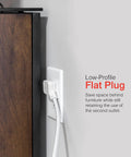 Three-Outlet Power Strip With Surge Protection, Pack Of 10, 8 Ft Braided Extension Cord, Grounded Flat Plug in use behind furniture