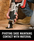 Close-up of Compact 20V Max Cordless Reciprocating Saw with variable speed, cutting wood with pivoting shoe.