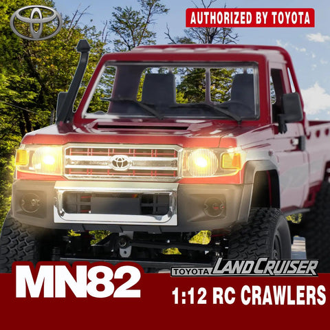 Front view of red Toyota 1/12 Scale RC Rock Crawler Pickup Truck with 2.4GHz 4WD, headlights on in a forest setting.