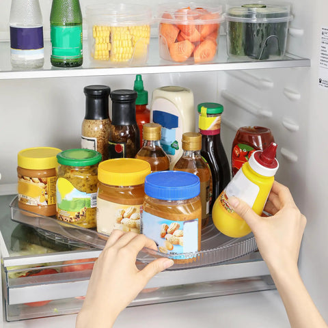 Person using Rectangular Lazy Susan Organizer For Large Refrigerator With 360 Degree Turntable 16.54 Inch Rotation Shelf with condiments