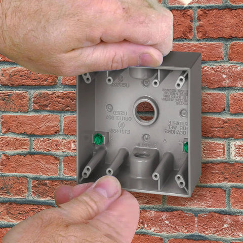 Rugged Heavy Duty Metal Electrical Outlet Box Weatherproof Two Gang With Three Quarter Inch Knockouts installation on brick wall