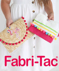 Person holding decorated fabric pouches with Fabri-Tac Premium Fabric Glue Quick-Drying Crystal Clear Permanent Bond For Fabrics Canvas