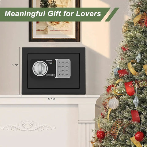 Compact Home Fireproof Safe Box With Digital Lock Mini Money Safe And Coin Safe With Code Wall Or Cabinet Safe For Personal Items Includes Fireproof Bag 0.236 Cu Ft Black Great For Home Office Desk Or Nightstand Storage Of Documents Cash Jewelry Passports displayed on a white shelf next to a decorated Christmas tree.