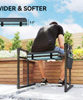Man sitting on 330 Pound Heavy Duty Garden Kneeler and Seat with foldable frame and thick kneeling pad in garden setting.