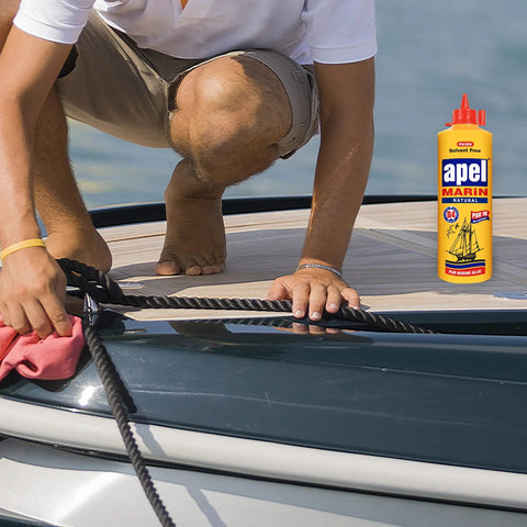 Person using Heavy Duty Waterproof Polyurethane Glue For Boats And RVs 20.3 Fl Oz Marine Adhesive on a boat deck for repair