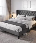 Modern Queen Bed Frame with Sturdy Button Tufted Wingback Headboard in Cool Dark Grey Upholstered Platform Setup in a stylish bedroom.