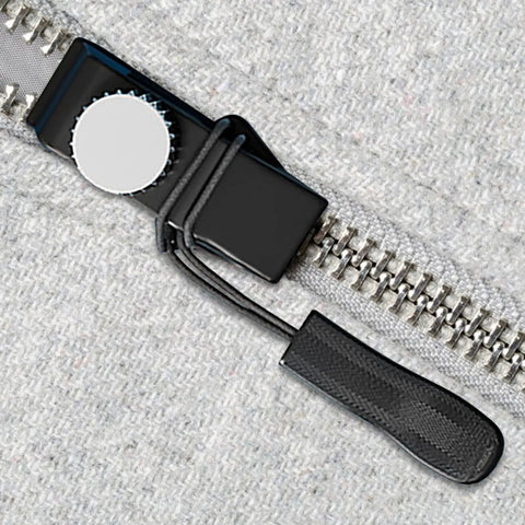Close-up of Instant Zipper Repair Kit For Backpacks And Travel Gear, Zipper Slider Fix Pack on a zipper track, showing the removable tool.