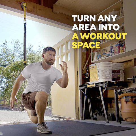 Man performing lunges in garage using Rock Solid Home Gym Wall Mount For Suspension Training Straps, Heavy Duty Steel Bracket.