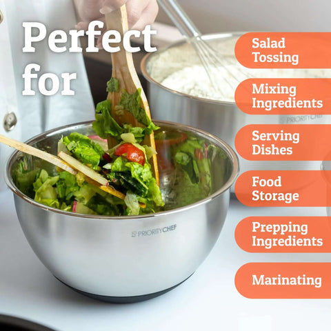 Person preparing salad with Stainless Steel Mixing Bowls With Lids Set Featuring Airtight Lids And Non Slip Base, Five Nesting Bowls