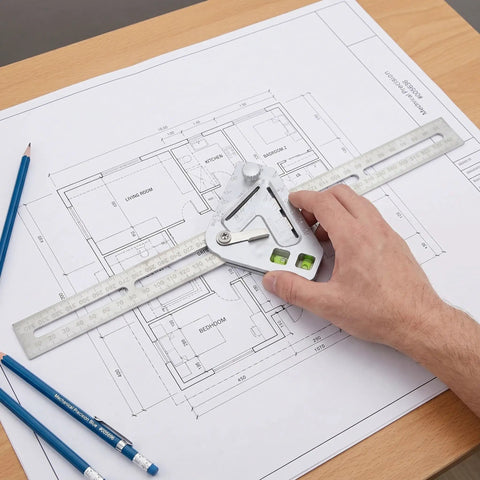 Hand using Pro Grade Stainless Steel Angle Ruler And Carpenter Square on blueprint, precise angle readings, durable for woodworking and material cutting.