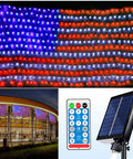 Patriotic Flag String Lights With Solar Or USB Power, 420 LED Net Light For Outdoors shown installed and remote with solar panel
