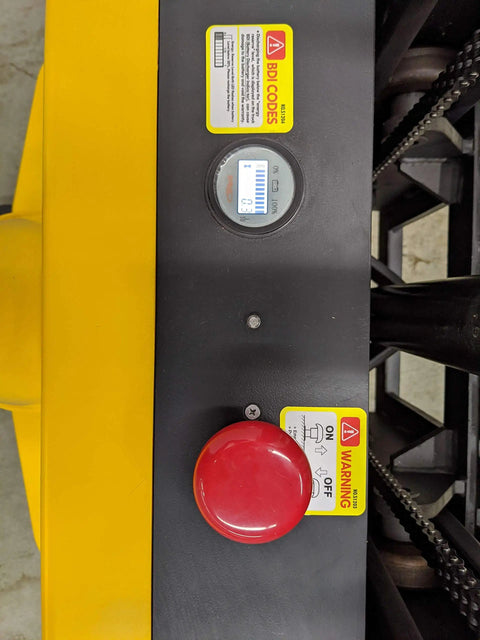 Control panel of Built Tough Electric Wide Leg Pallet Stacker Heavy Lifter, showing battery gauge and emergency stop button.