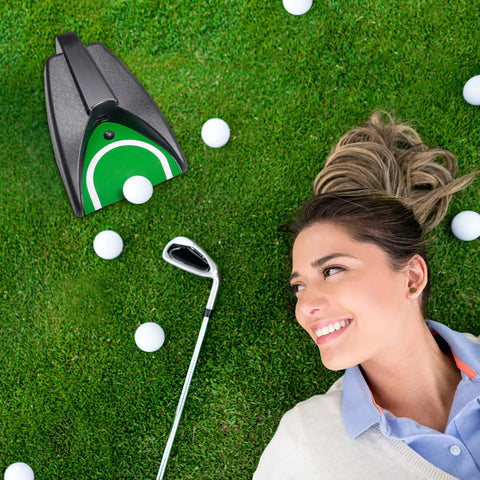 Woman laying on grass with Auto Returning Golf Putting Training Aid For Indoor And Outdoor Practice Cordless Battery Powered next to golf club.