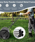 Person using 24 Inch Lawn Compost Spreader and Lawn Roller For No Fuss Topdressing Fertilizer And Seedling Care in a garden
