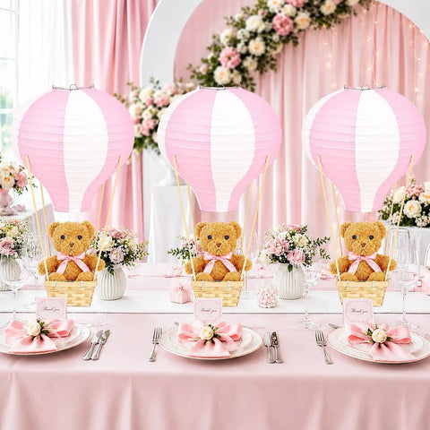Bear Themed Hot Air Balloon Centerpiece Kit For Baby Shower And Gender Reveal With 6 Pink Paper Lanterns displayed on a decorated table.