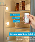Wireless LED Puck Lights 3 Pack With Remote Control For Under Cabinet Lighting, shown in pantry with magnetic mounting.
