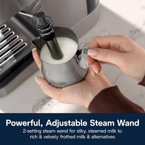 Espresso Machine With Milk Frother And 15 Bar Pump For Lattes Cappuccinos And Iced Coffee At Home Barista Quality Shots And Creamy Froth Every Time For You, showing close-up of steam wand in use with milk pitcher.