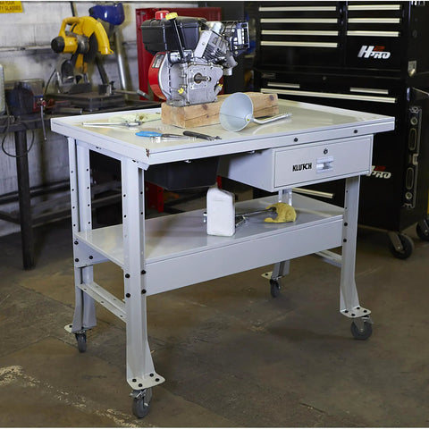 Beefy Heavy Duty Tear Down Table Workbench with Drain, Steel Work Surface and Built In Containment Basin, Lockable Storage Drawer, 1000 Lb Capacity, Four 4 Inch Poly Swivel Casters Two Locking For Easy Mobility in garage setting
