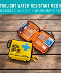 UltraLight Mini First Aid Kit Three Pack For Hiking Camping And Travel Ultralight Water Resistant Medical Kit displayed open and closed.