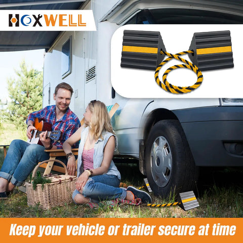 Tough Rubber Wheel Chocks For RVs Trailers Campers Trucks Cars Aircraft And Boats With Reflective Strips next to camper.