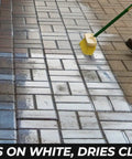 Applying Premium Patio Paver Sealer Low Gloss Water Based Clear Stone Sealant on pavers, visible texture and moisture before drying.
