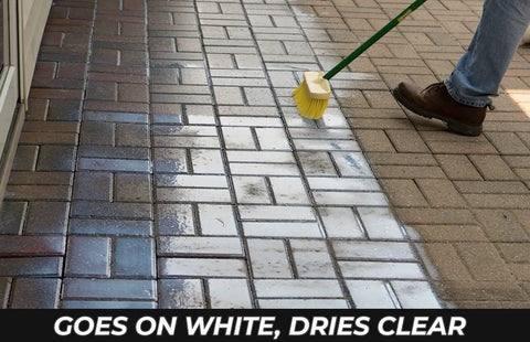 Applying Premium Patio Paver Sealer Low Gloss Water Based Clear Stone Sealant on pavers, visible texture and moisture before drying.