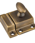Top Shelf Antique Brass Cabinet Door Latch With Classic Oval Turn Spring Loaded Cupboard Hardware Heavy Duty Brass Vintage Catch close-up view.