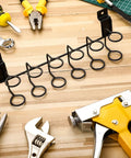 2 Pack Slatwall Tool Holders for Screwdrivers and Pliers, black galvanized metal hooks shown on wooden surface with tools.