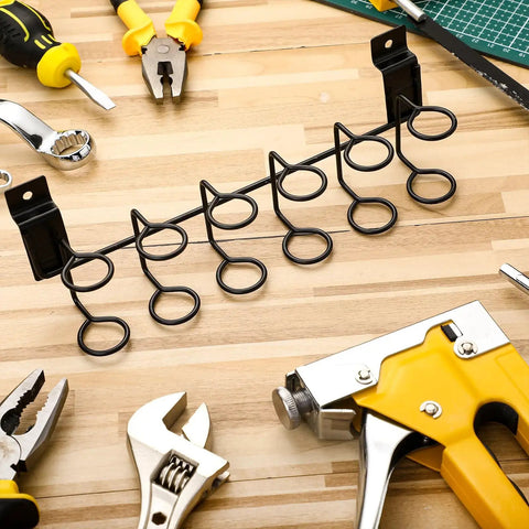 2 Pack Slatwall Tool Holders for Screwdrivers and Pliers, black galvanized metal hooks shown on wooden surface with tools.