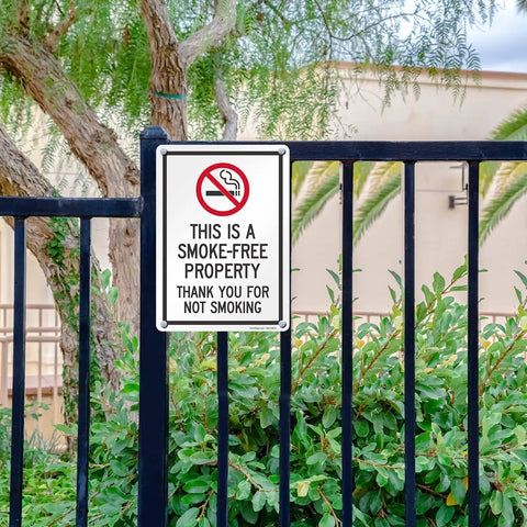 Straight Up Smoke Free Property Sign Featuring Bold No Smoking Symbol, 14 X 10 Inch Heavy Duty Rustproof Aluminum Metal Wall Yard Sign, Super Durable Indoor Outdoor Setup, Made Right In Usa on a fence.