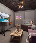 Cozy indoor room with a sofa, television, electric guitar, and a woman relaxing in a hot tub, featured under a 'Rock & Relax' sign.