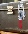 Silver Toggle Latch Clamp Set, U Bolt Toggle Latches on a brown trunk, 360 Lb Holding Capacity, 4.75 Inch Adjustable Hardware